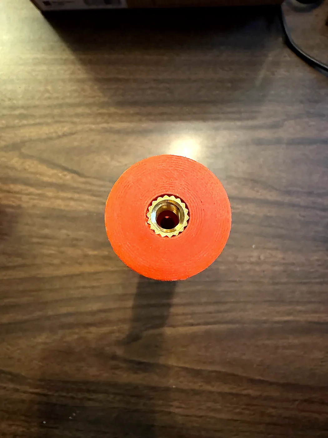Brass quarter-inch threaded insert installed in the base of the Hamdo body