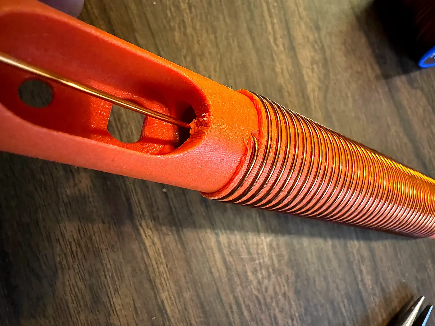 Lower magnet-wire lead routed through the Hamdo body opening