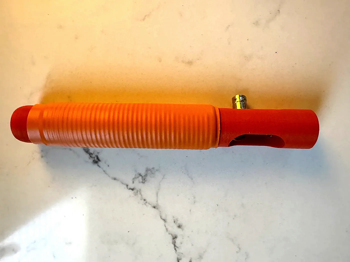 Completed orange Hamdo body with the loading coil covered by heat-shrink tubing